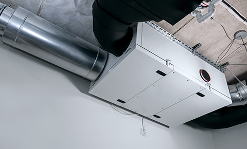 a modern heat recover system mounted to the ceiling of a building